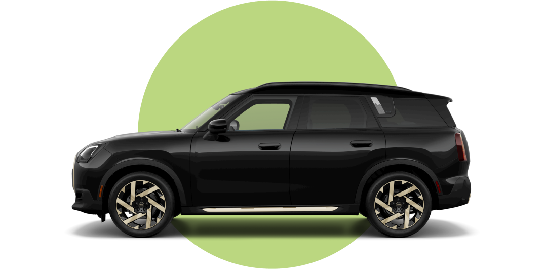Side view of a 2025 MINI Countryman SE ALL4 in the Midnight Black III body color, facing left with its shadow underneath it.