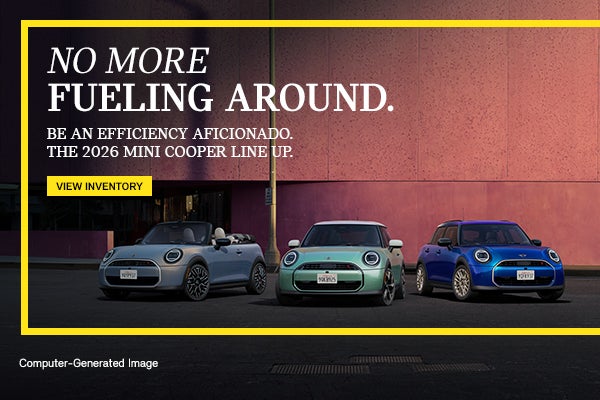 MINI fleet infront of pink wall.